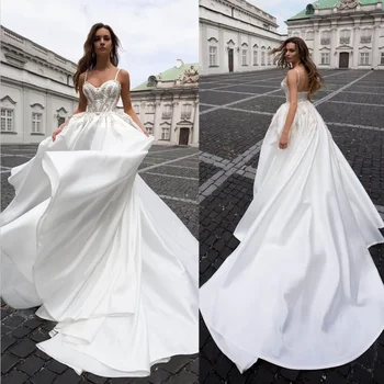 Sexy Custom Sweetheart Spagečių vestuvinės suknelės A Line Floor-Length Sweep Train Applique Satina Long Backless Bridal Gowns